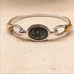 Avon silver and gold tone bangle bracelet